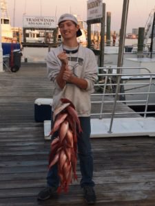 my younger son with the family's catch